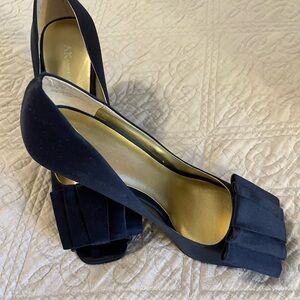 Navy blue satin Ann Klein heels. Very classic and traditional.
